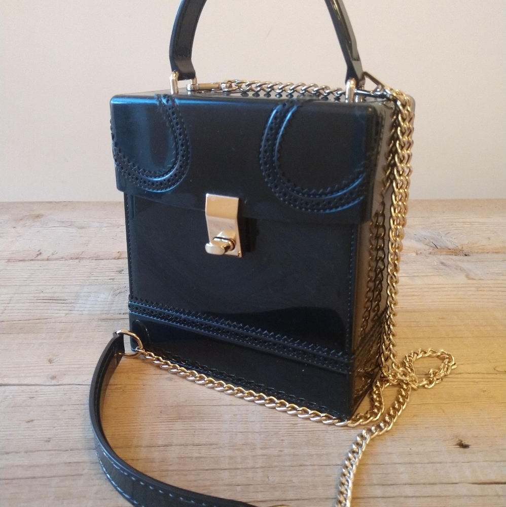 Black jelly boxy mini purse.